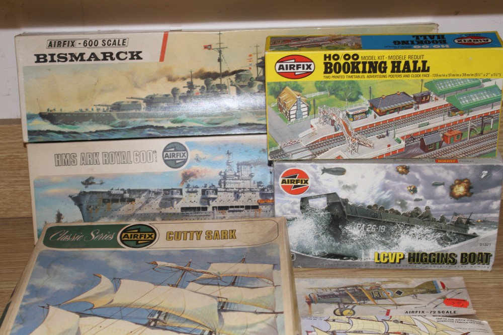 A group of vintage boxed and complete Airfix kits, comprising: Cutty Sark, Bismarck, HMS Ark Royal, LCVP Higgins boat 01321, OO Booking